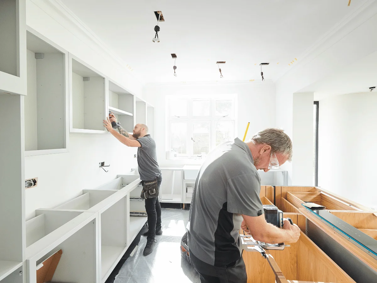 Installing custom kitchen units, worktops, and cabinetry for a seamless design