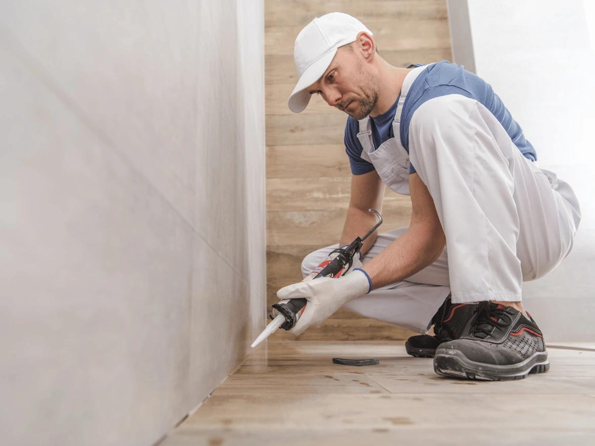 Resealing shower areas to prevent leaks and maintain waterproofing